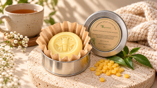 Kaantam natural body lotion bar in a silver tin with a kraft paper liner, beside a cup of tea and a knitted throw, a winter moisturizer for dry skin